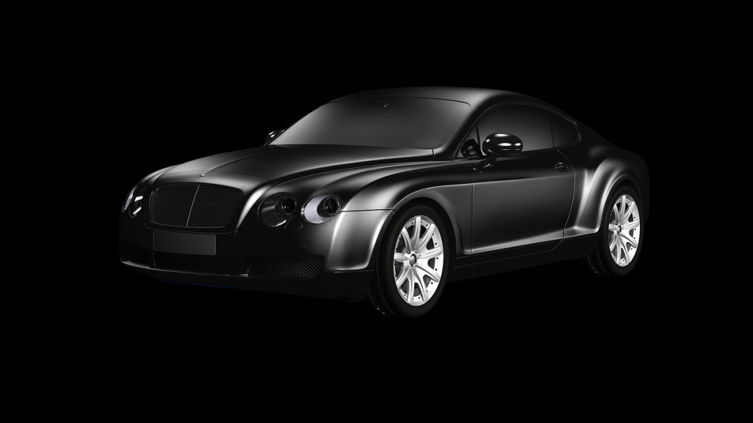 black luxury sedan hotel valet